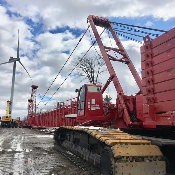 lattice boom crane installing a wind turbine